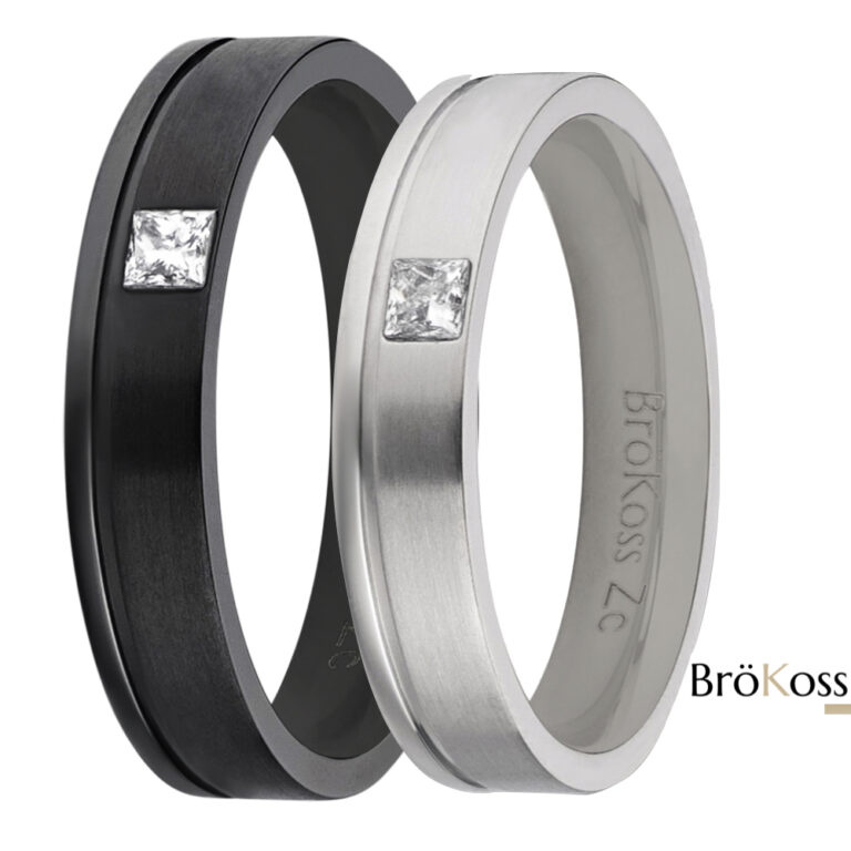 Par de alianzas de hombre estilo oro en zirconio gris y negro, una con diamante cuadrado y otra lisa, sobre fondo blanco