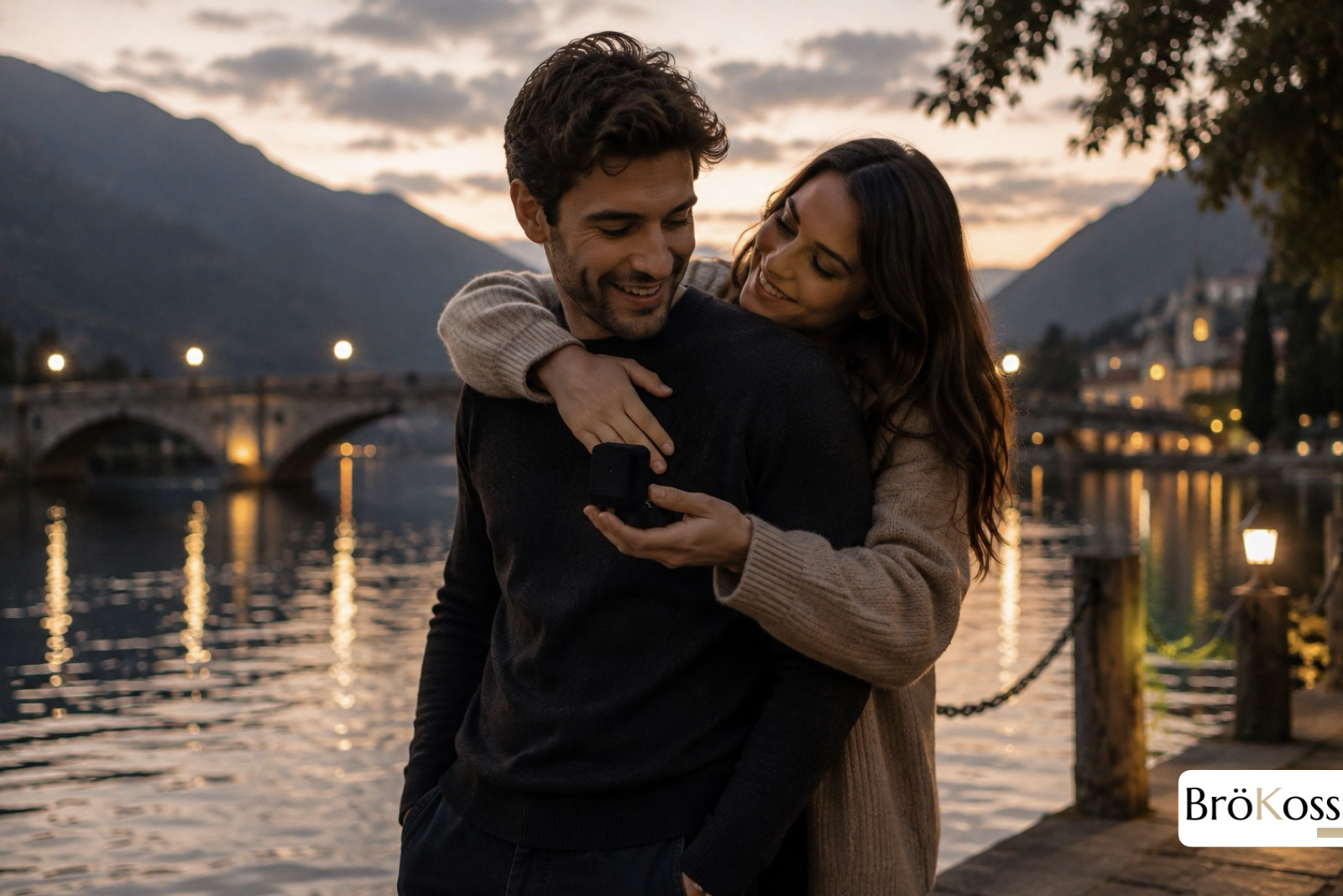 Pareja abrazada junto a un lago después de una pedida de matrimonio